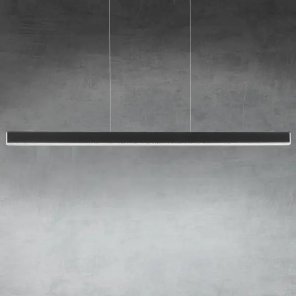 A restrained silhouette, luxuriously bound in vintage leather for a look of disciplined decadence. The slender pendant reveals a shimmering diffuser of applied crystal gemstones that transmute the bright integral LEDs for ample task illumination.