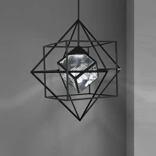 A geometric phenom with striking depth and dimension. This stunning modern design showcases an illuminated faceted Optic Crystal cube within tumbling cubes, like high-roller dice.