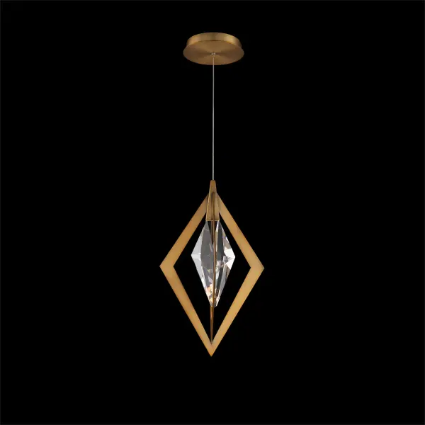 The Amoureux mini pendant combines architectural precision with crystalline elegance. Its pyramid-inspired aged brass frame suspends an elongated optic crystal element, creating striking light refraction and visual interest in compact spaces.