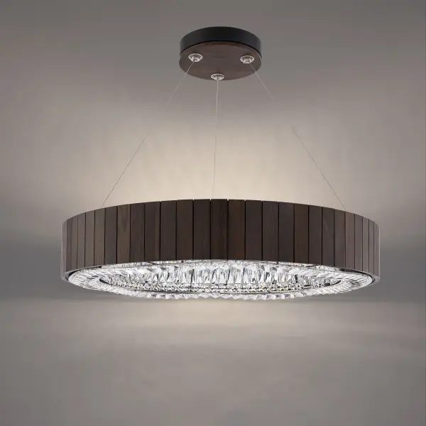 This oversized pendant masterfully combines raw wood texture with faceted crystal elements, delivering both sculptural presence and sophisticated lighting. The 33-inch diameter makes a bold statement while integrated LED technology provides efficient, adjustable illumination.