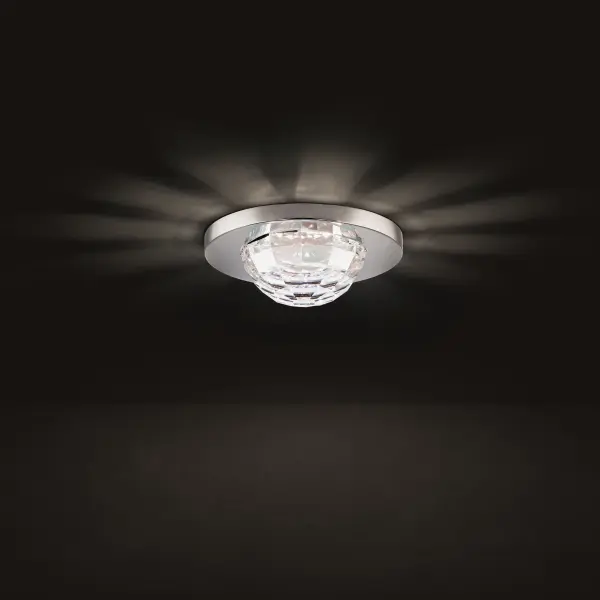 A smoothly faceted Schonbek Radiance® Crystal shade emanates sparkling symmetrical light, bringing charm and balance to every home’s design.
