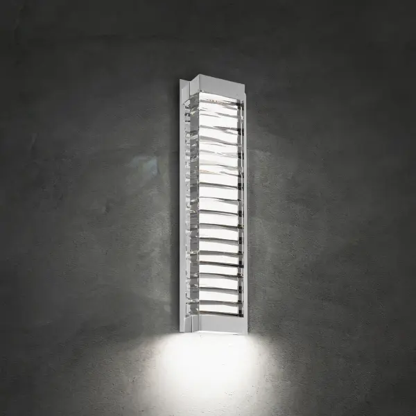 A faceted abstract design of solid Optic Crystal. Hidden LEDs illuminate the crystal internally and also provide downlight for wayfinding on this interior wall sconce.