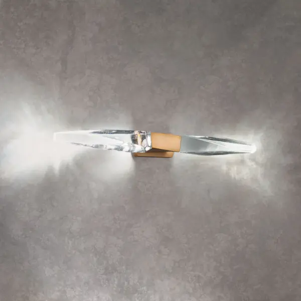 A subtle twist of luxe. Kindjal features exquisite Optic Crystal icicles that twist to a point from a cohesive metal casting, concealing a powerful LED that provide ample illumination. Stylish, textured materiality.