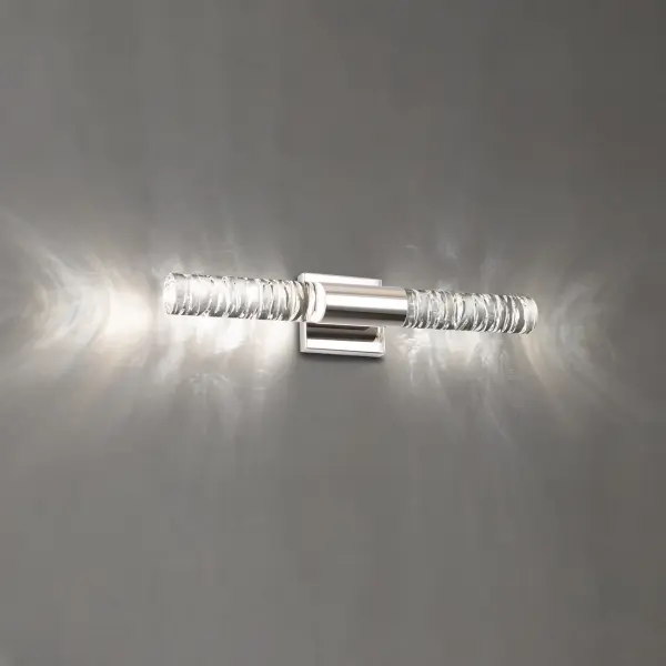 Appealing to your sensibility, this sculpted Optic Crystal design evokes a dimensional look of fluidity. A clear cylinder touched by a little grace.