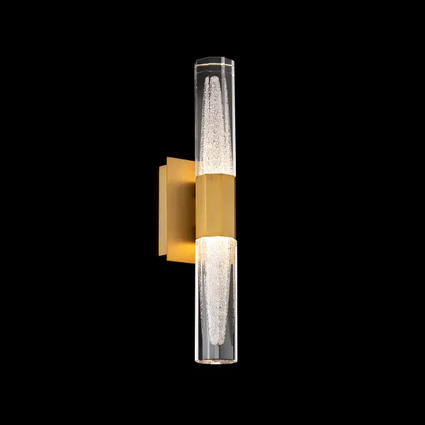 Drawing its dramatic presence from the angular beauty of icy mountain peaks, Josefina sparkles from faceted diffusers filled with Radiance® Crystal Dust that rise like sculpted ridgelines. Light refracts through the layered geometry, creating a crystalline glow that feels both crisp and atmospheric. Geometric planes intersect to form an unexpected, architecturally bold silhouette that provides visual contrast against the luminous surfaces.