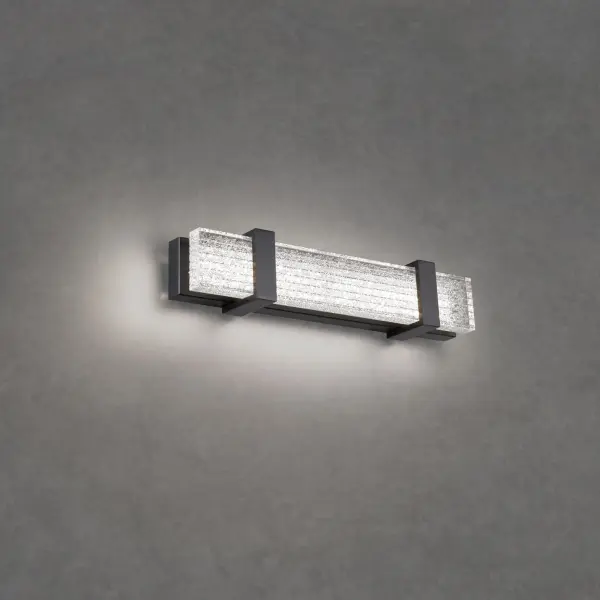 A stunning bath sconce for the ages commands attention with V-cut channels precisely hand-applied with Schonbek Radiance® Crystal Dust.  This ADA Compliant luminaire may be mounted vertically and horizontally as a vanity light or wall sconce.