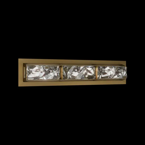 Drizzle captures the raw elegance of sculpted ice in a bold, architectural silhouette. Its pressed-glass diffuser showcases angular, rippling facets that refract LED light with the luminous depth of frozen water in motion. A refined metal frame surrounds the glass, delivering crisp structure, heightened contrast, and a striking contemporary presence.