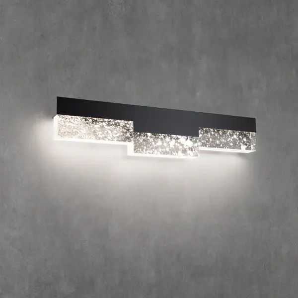 Accentuate a modern bath with a geometric work of art. LEDs concealed within the frame illuminate dimensional blocks of translucent Optic Haze® Quartz, making this luminaire a dramatic option to light a vanity.