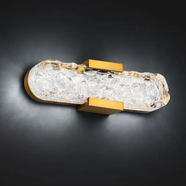 Dramatic and enchanting. An extravagant visual texture creates dazzling reflections from the pressed glass and Radiance® Crystal Dust diffuser suspended within this luminaire's gleaming aged brass crown.