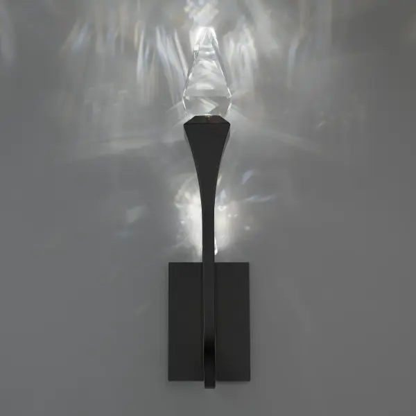 Like an architectural marvel, sparkling tapered crystal elements crown the ends of sleek, curving arms in an elegant composition. LED illumination filters through the faceted crystal, reflecting off the polished arms to create a stunning, ambient glow that fills the space with brilliance.