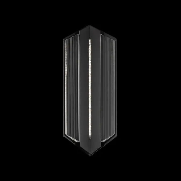 Crisp geometry meets luminous craftsmanship in the Outlook outdoor wall sconce. Its boldly angled silhouette frames a vertical Optic Crystal diffuser filled with shimmering Radiance® Crystal Dust, creating a striking interplay of structure and sparkle. Color-selectable LED illuminates the crystalline core, bringing modern elegance and personalized illumination to any exterior.