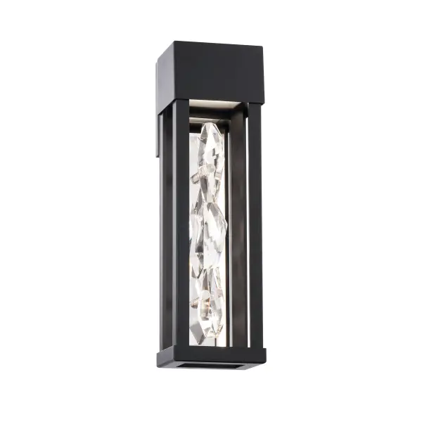 Clean lines frame a shimmering pour of crystal. Illuminated from above, the brilliant column captures rhythms and textures of transparency, luminosity and shadows creating a stunning focal point on a luxury home’s exterior.