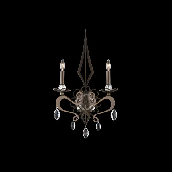 With its intricate symmetry and haunting grace, Persephone is a sculptural symbol of devotion, mystery, and eternal elegance. The luminaire's handcrafted, curving arms and angular column recall the grandeur of cathedral ironwork, where arched forms, pointed spires, and graceful scrolls unite in a silhouette of gothic splendor. Candelabras rise from crystal bobeches, poised in a delicate balance between fragility and strength, while faceted Radiance® Crystal drops glimmer below in quiet brilliance.
