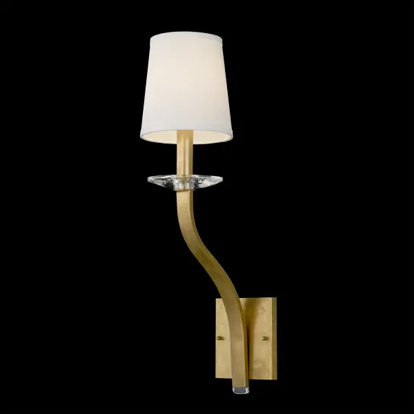 Graceful simplicity defines Catalena, a design that feels both elegant and substantial. Gently curved arms sweep upward, unified by a circular bottom band and crowned with a hand-cut crystal bobeche. Crisp white shades softly diffuse the light from concealed candelabra bulbs. Catalena harmonizes sculptural balance with quiet sophistication.