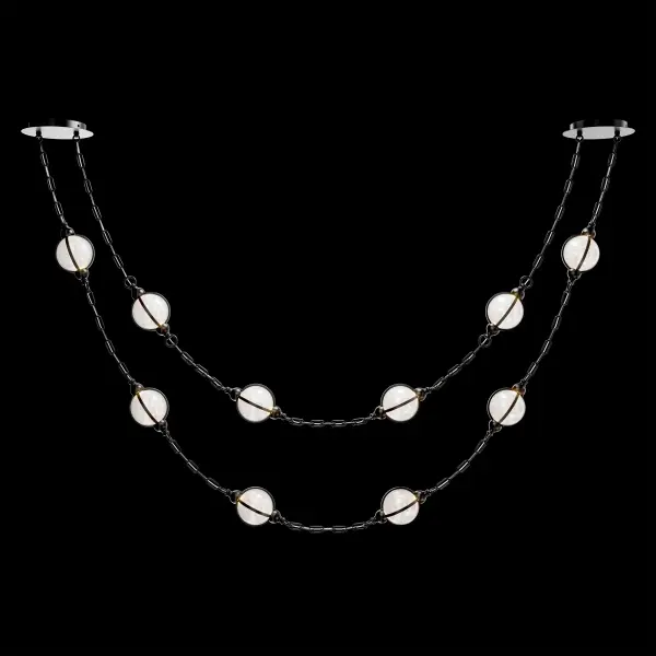 Lovelace celebrates the beauty of ornamentation on a grand scale. Blown glass orbs with Radiance® Crystal dust sparkle like cut gemstones along a delicate strand.