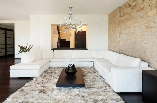 The Floridia chandelier features Firenze crystal drops and multi-faceted bobeches suspended from gracefully curved polished chrome arms. Its 27-inch diameter and adjustable height make it versatile for both contemporary and traditional spaces. - alternate view