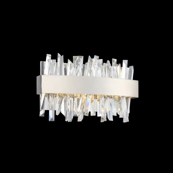 The Glacier Bath Sconce combines contemporary elegance with functional design. Ice-shaped crystal spears are backlit by integrated LED strips within a polished chrome frame, creating a unique sculptural lighting effect perfect for modern bathrooms.