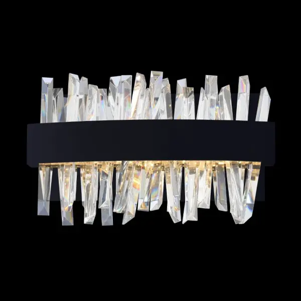 The Glacier LED Bath Sconce combines modern design with functional elegance. Featuring chiseled clear crystal spears and integrated LED lighting in a sophisticated matte black finish, this ADA-compliant fixture delivers both style and accessibility.