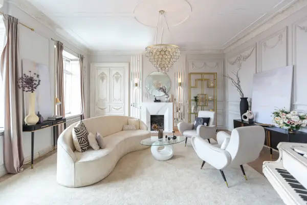 The Carmella pendant combines Art Deco elegance with modern sophistication. Its 27-inch faceted crystal teardrop suspended in a curved shadow box creates dramatic visual impact, while the champagne gold finish adds warmth and luxury to any space. - alternate view
