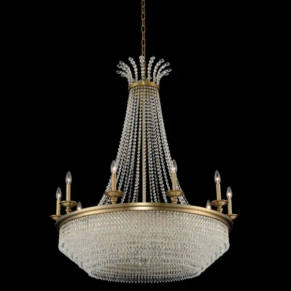 The Tavo 15-Light Chandelier commands attention with its impressive 40-inch diameter and cascading Firenze crystal strands. The Winter Brass finish bridges traditional elegance with contemporary sophistication, making it perfect for grand spaces.