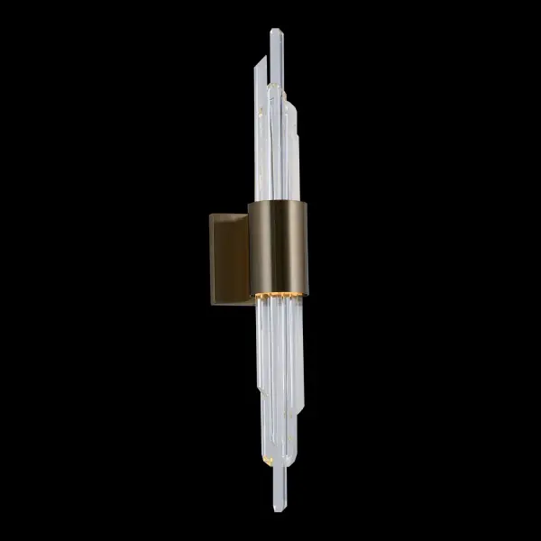 The Lucca LED Wall Sconce combines faceted crystal rods with a brushed champagne gold band for a jewelry-like aesthetic. Its bi-directional lighting creates a soft, ambient glow perfect for bathrooms and intimate spaces.