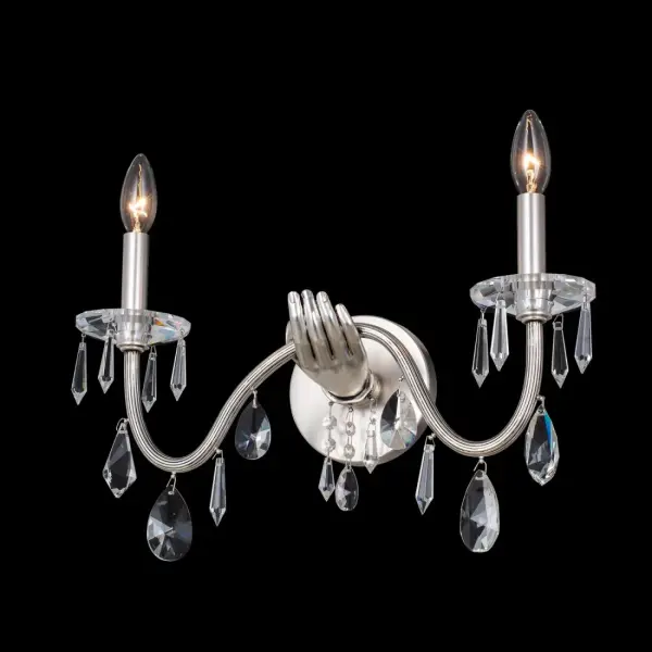 The Venere wall sconce transforms lighting into art with its surrealist-inspired design. Cast solid brass construction with clear Firenze crystal drops creates dramatic visual interest while providing elegant ambient lighting.