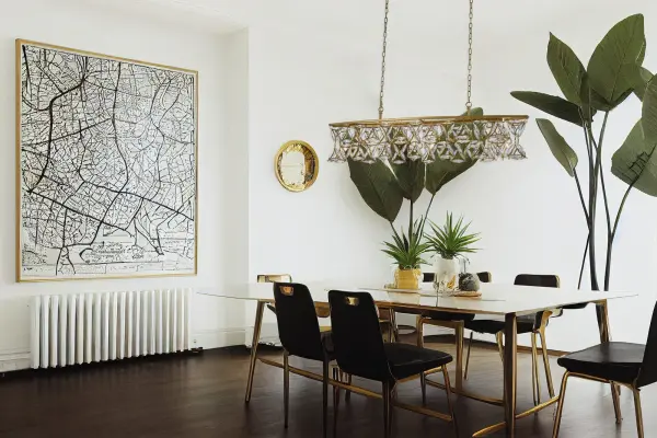 The Triangulo Island Light features exaggerated almond-shaped Firenze crystals creating a sparkling curtain effect with cast brass triangle frames. Its 60-inch linear design combines modern geometry with soft Bohemian curves, perfect for making a statement over kitchen islands or dining tables. - alternate view
