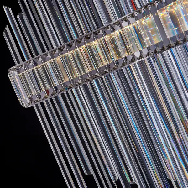 The Piovere pendant is a stunning light sculpture featuring hexagonal solid crystal rods suspended between mirror-polished stainless steel plates. Its random crystal curtain design creates a unique visual spectacle perfect for grand spaces. - alternate view