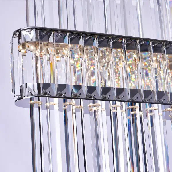 The Piovere Island Light transforms functional lighting into avant-garde art with its futuristic design featuring hexagonal crystal rods suspended between mirror-polished stainless steel plates. This 60-inch linear masterpiece delivers both dramatic visual impact and exceptional LED illumination. - alternate view