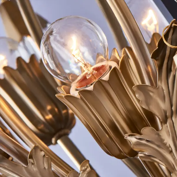 The Tulipani Wall Sconce combines classical elegance with contemporary lightness through its dynamic brass curves and Firenze crystal tassels. The Winter Brass finish and organic growth-inspired design create a sophisticated statement piece. - alternate view