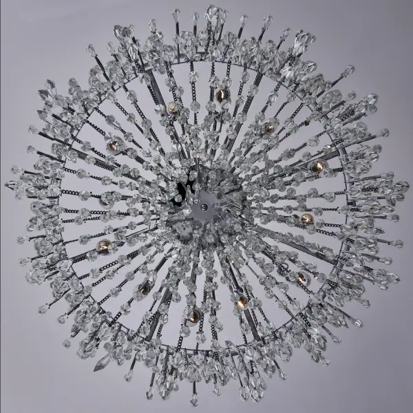 The Frangia pendant brings sophisticated boho-chic style with cascading crystal spears suspended from chains. At 29 inches wide and featuring organized randomness in its fringe design, this statement piece combines contemporary glamour with artisanal craftsmanship in polished chrome. - alternate view