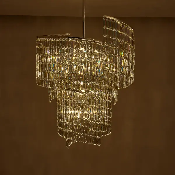 The Vortice foyer pendant transforms grand entryways with its cascading iridescent crystals arranged in a graceful waterfall pattern. At 31" wide and 40" tall, this statement piece creates a tranquil, sophisticated ambiance perfect for high-ceiling spaces. - alternate view