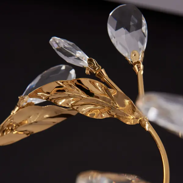 The Ramo Island Light combines organic, nature-inspired design with luxurious crystal and 24K gold finish. Its 48-inch linear form and delicate branch-like structure create an airy, elegant focal point perfect for kitchen islands and dining tables. - alternate view