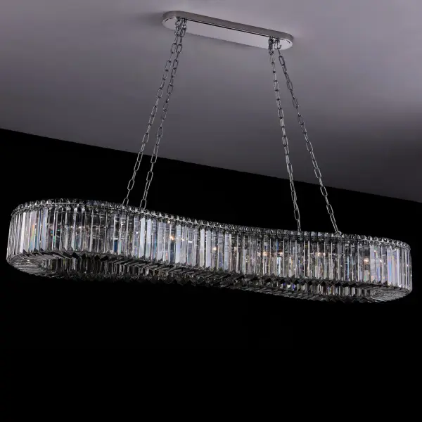 The Corda Island Light masterfully blends timeless crystal craftsmanship with modern design. Its 63-inch linear profile features undulating crystal rings suspended from polished chrome hardware, creating dramatic visual impact perfect for large spaces. - alternate view