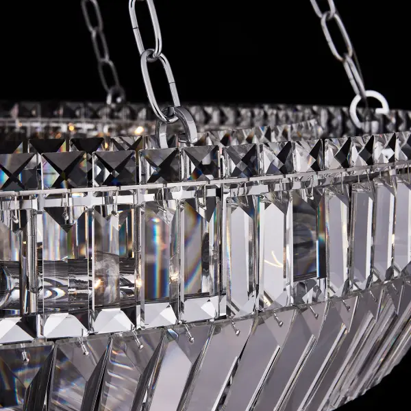 The Circolare 36" pendant combines elegant crystal detailing with a sleek polished chrome finish in a dramatic ring design. Its substantial 36-inch diameter makes a bold statement while the adjustable chain allows customization for various ceiling heights. - alternate view
