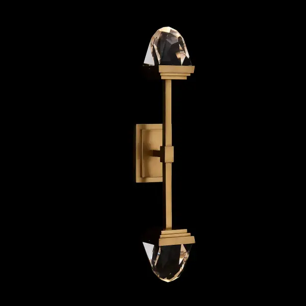 The Taglio LED Wall Sconce brings jewelry-inspired elegance to modern interiors with its faceted solid crystal blocks and robust brass construction. Integrated LED lighting with dimming capability offers both beauty and functionality.