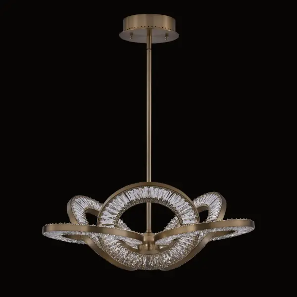The Rotondo pendant captivates with its intricate Celtic knot-inspired design and interlocking circular geometry. Featuring concealed LED technology with adjustable color temperatures (2700K-4000K) and dazzling crystal construction in Winter Brass finish, this statement piece delivers both visual drama and functional versatility.