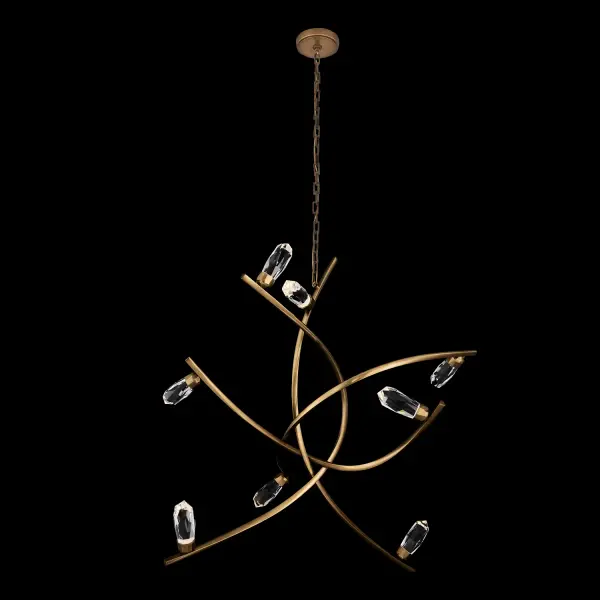 The Bilancia chandelier is a show-stopping 48-inch fixture that combines artistic sculpture with functional lighting. Large crystals appear to float atop sweeping brass arms, with individual LEDs illuminating each crystal for dramatic sparkle.