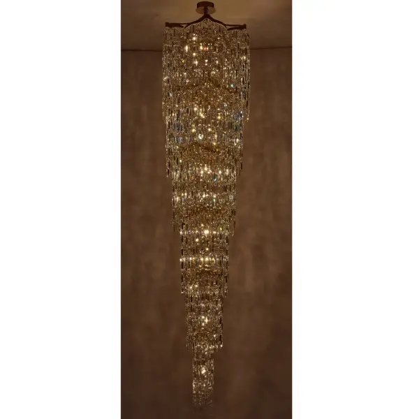 The Cadere Foyer Light transforms grand entryways with cascading Firenze Crystals suspended from an undulating 18K gold frame. At 26" wide and 110" tall, this dramatic fixture creates mesmerizing visual texture inspired by waterfalls. - alternate view