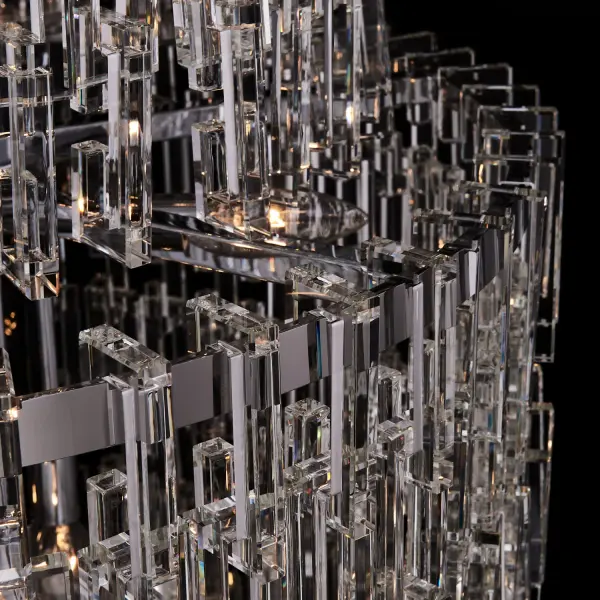 The Catene creates a dramatic waterfall effect with geometric crystal links cascading nearly 8 feet. Its polished chrome finish and substantial 27-inch diameter make it ideal for grand entryways and high-ceiling spaces requiring bold visual impact. - alternate view