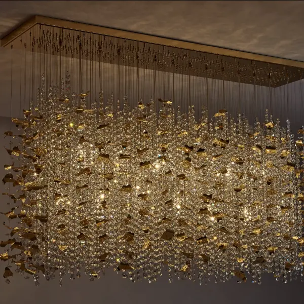 A breathtaking oversized flush mount featuring swirling crystal strands inspired by floating leaves. The luxurious 18K Gold finish and adjustable 8-foot strands create a dramatic focal point perfect for grand spaces. - alternate view