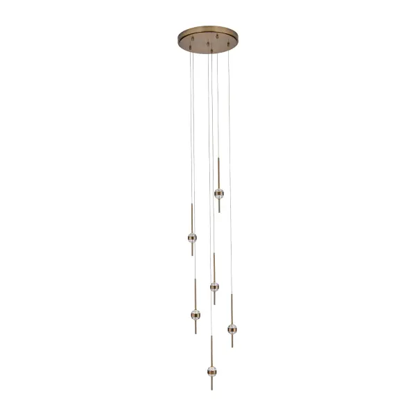 The Goccia chandelier transforms any space with its jewelry-inspired design, featuring oversized crystals pierced by a Winter Brass frame. Integrated LED lighting creates captivating sparkle with both up and down illumination. - alternate view