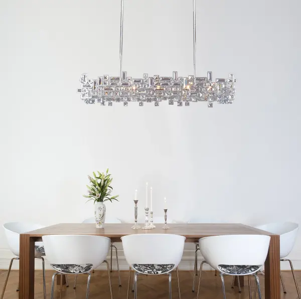 The Vermeer brings De Stijl artistic principles to life with clear prism crystals arranged in asymmetric patterns. Its 44-inch linear design and polished chrome finish create a sophisticated focal point perfect for modern dining spaces and kitchen islands. - alternate view