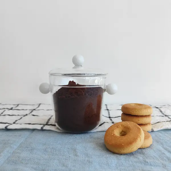 The Bilia jar combines practical storage with contemporary design. Its compact 16.9oz capacity and dual handles make it perfect for organizing small items while adding a decorative touch to any space. - alternate view