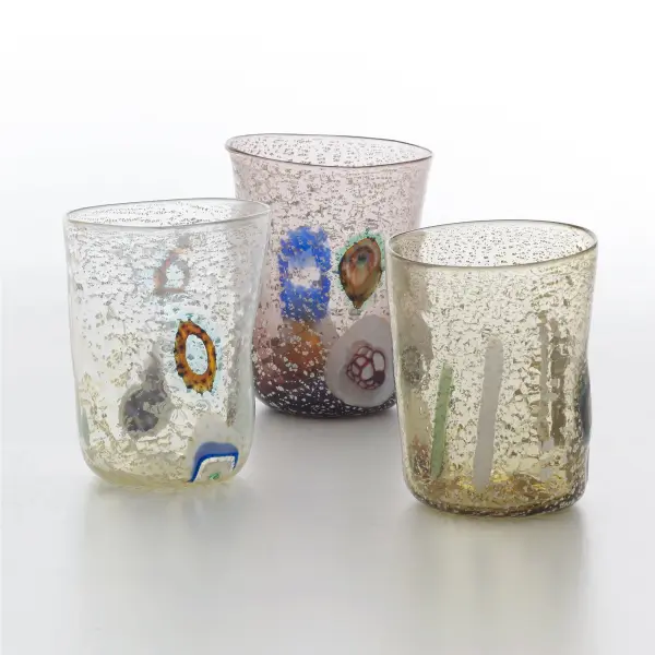 These authentic Murano glass tumblers showcase centuries-old Venetian craftsmanship. Each piece is uniquely hand-blown by master glassmakers using traditional techniques with murine, glass rods, and silver leaf elements. - alternate view