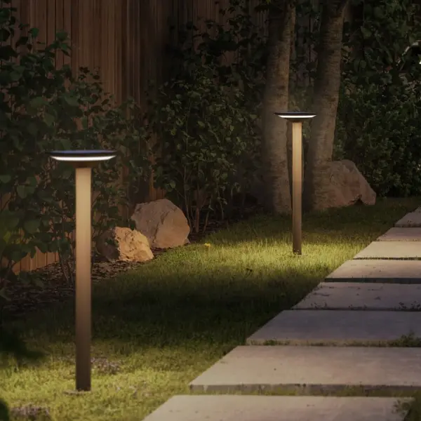 The Keope Ground is a sophisticated solar-powered outdoor lamp featuring automatic daylight sensing, IP65 weather resistance, and 23-25 hours of runtime. Its die-cast aluminum construction and warm 3000K LED create elegant pathway illumination.