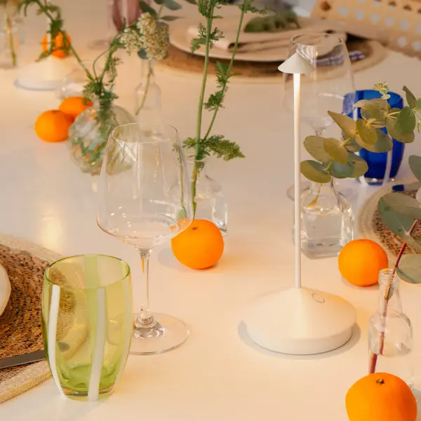 The Pina Pro is a sleek, minimalist cordless table lamp that delivers powerful illumination without obstructing views. Its rechargeable design offers 12 hours of runtime with adjustable color temperatures, making it perfect for dining and outdoor spaces. - alternate view