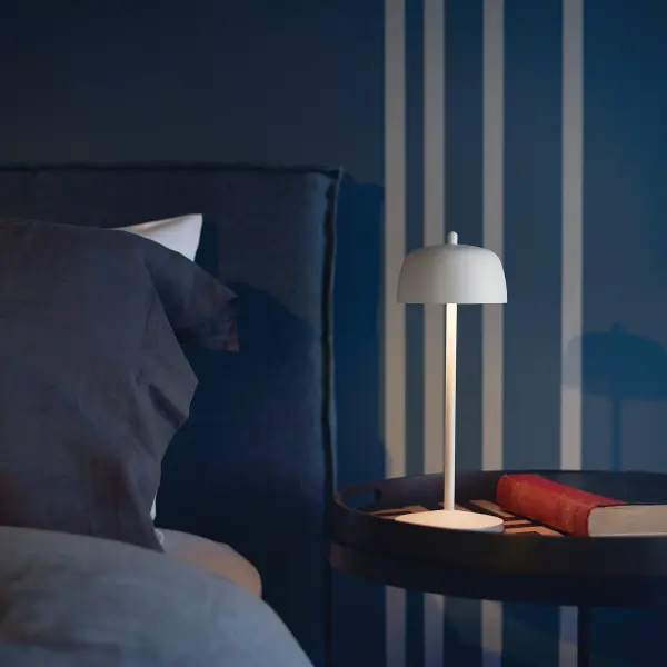 The Theta Pro combines iconic bell-shaped design with modern functionality. Battery-powered with 9+ hours of runtime, tunable color temperature (2200K-3000K), and IP65 rating for indoor/outdoor use. - alternate view