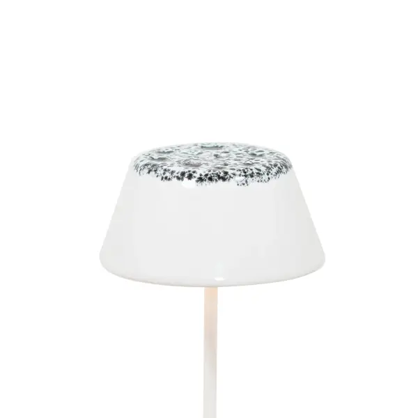 This artisanal ceramic lampshade brings Italian craftsmanship to cordless lighting. Hand-painted with a striking white and black finish, it attaches magnetically to Swap Mini lamps for easy customization.