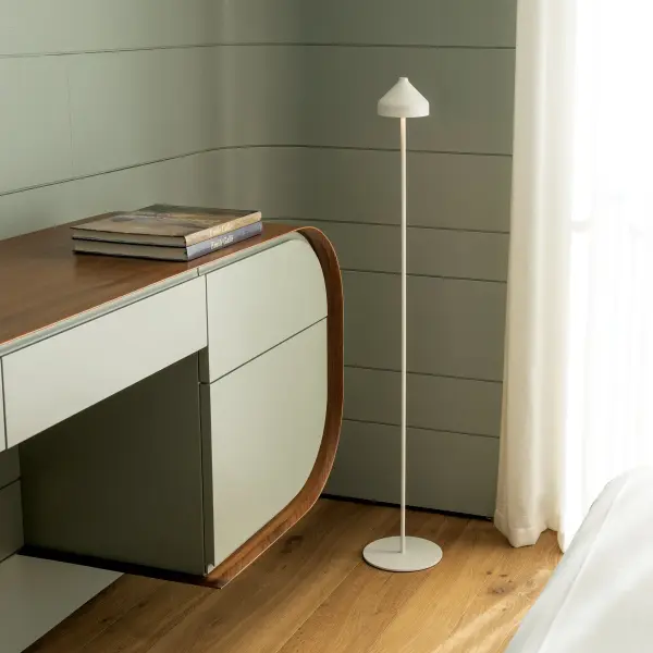 The Amelie Pro Floor Lamp combines elegant design with cutting-edge technology. This portable, rechargeable lamp offers 10 hours of illumination, three color temperatures, and IP65 weather resistance for indoor-outdoor versatility. - alternate view